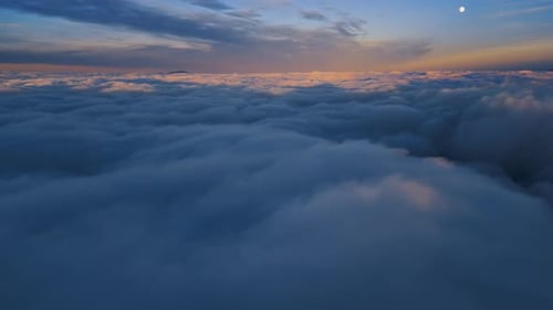 Magic View of Foggy Landscape at Sunrise above Blue Clouds Sky