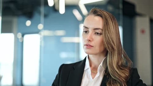 Professional Businesswoman Focused in Modern Office