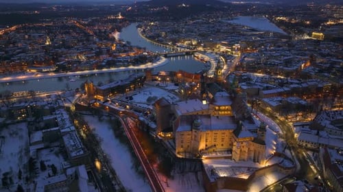 Winter evening view of Krakow's Wawel Castle illuminated by lights