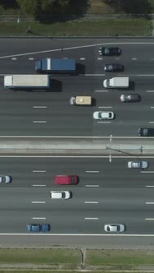 Cars on Highway in City in Sunny Summer Day Aerial Vertical TopDown View Vertical Video