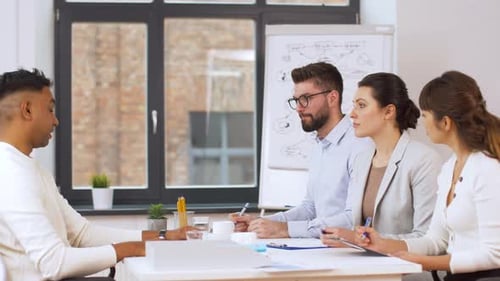 Business Team Meeting in Office, Taking Notes