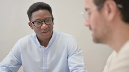 Close up of African Businessman Talking with Partner