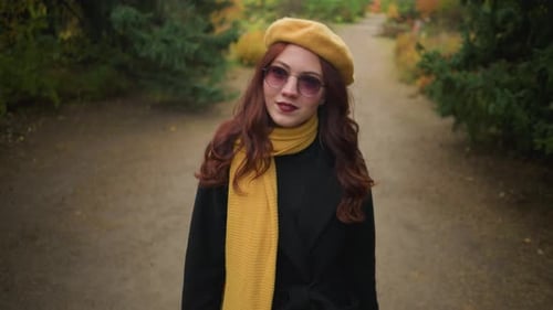 Elegant Lady in Yellow Beret Observes Surroundings in Park