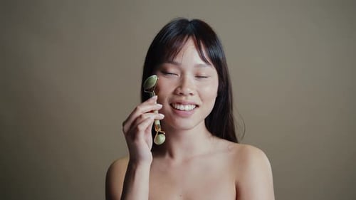 Asian woman beauty session in studio.