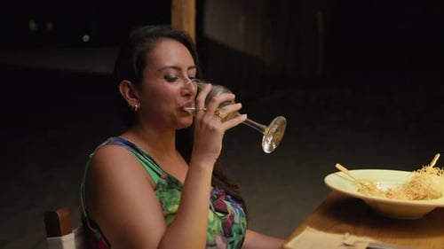 Woman Smiling And Drinking Wine Feeling Happy During The Restaurant Dinner