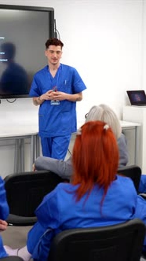 Medical Presentation by Young Doctor to Group
