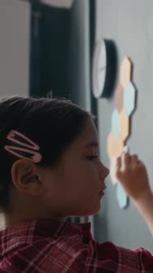 Vertical of Student Drawing Solar System Diagram on Classroom Blackboard