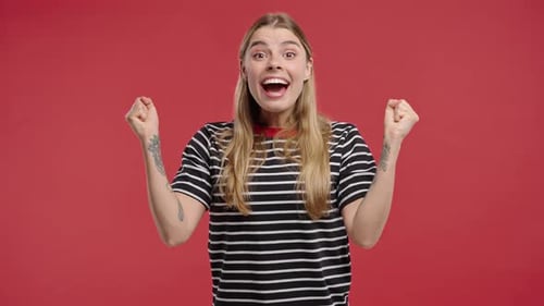 Woman Celebrating Success with Exuberant Joy and Triumph