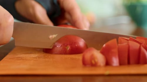 Fresh Tomato Being Sliced With Sharp Knife