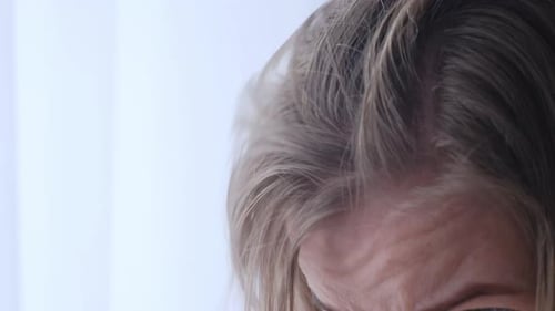 Early Gray Hair in a Young Woman Close Up