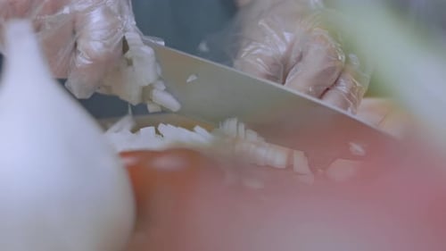 Chef Showing How to Cut Onion Into Cubes