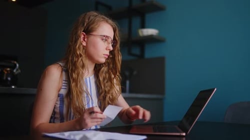Woman Working on Laptop at Home Office Desk