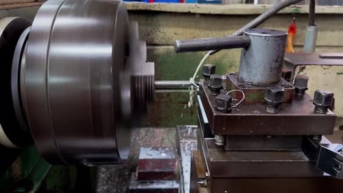 Lathe Machine Working on Metal Rod