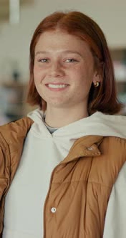 Happy, education and face of teenager in classroom at school for learning, knowledge or scholarship