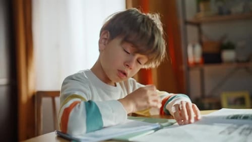 Overwhelmed Boy Studying Kitchen Desk Closeup Tired Elementary School Student