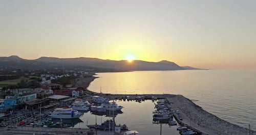 Aerial View of Sunset on Cyprus Coast Sun Setting Behind Mountains