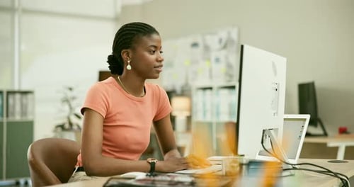 Computer, research and professional black woman in the office planning for creative project