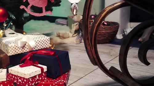 Christmas Presents under Decorated Tree in Home