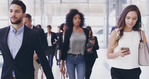 4k video footage of a group of businesspeople walking in a convention centre