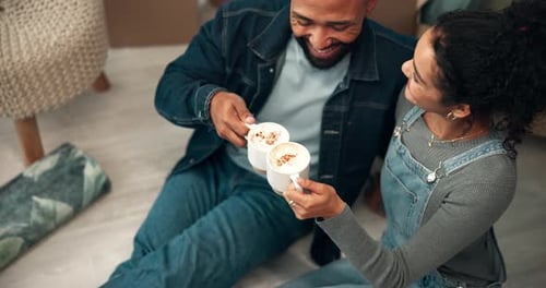 Couple Toasting Coffee in New Home