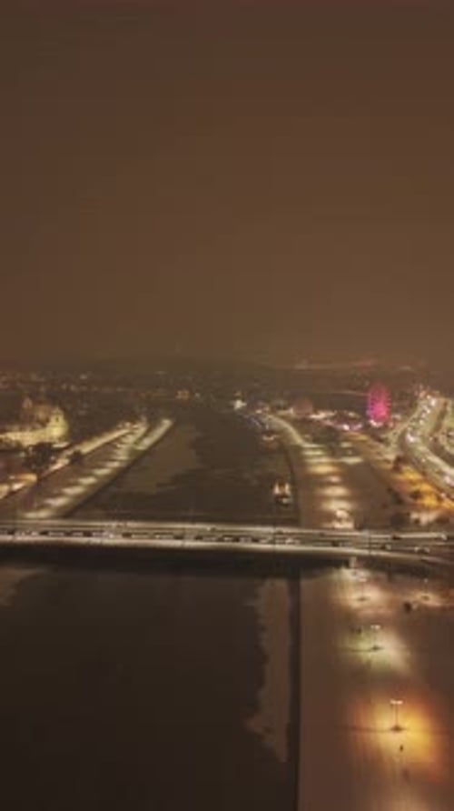 Aerial Evening View of Snowy Vistula River in Krakow with Ferris Wheel
