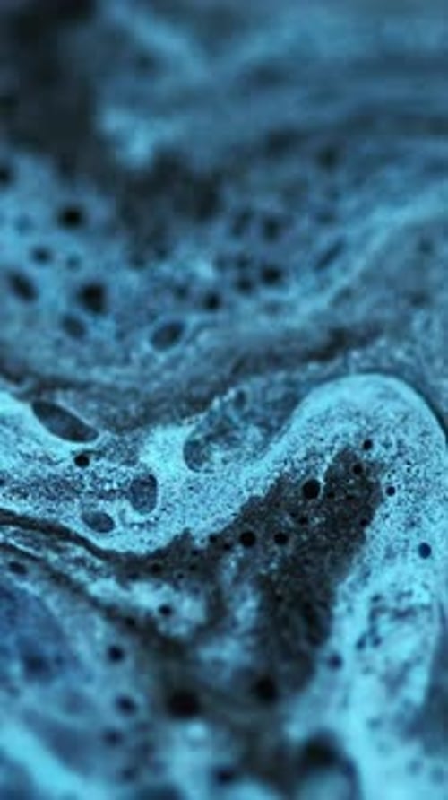 Swirling Blue and Black Abstract Paint Mixture