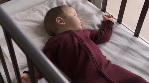 Baby Sleeping Peacefully in Crib