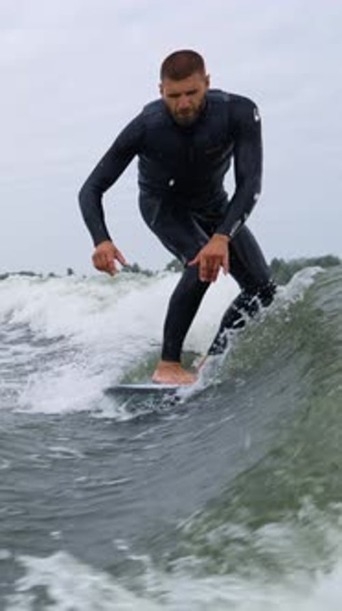 Surfing Adventure A Surfer Gliding on Waves with Style and Precision Captured in Two Dynamic Frames