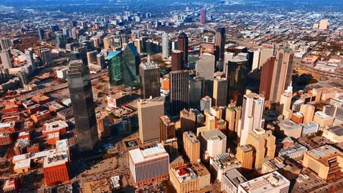 Architecture of modern American city from top. Drone footage above the downtown of Dallas, Texas.
