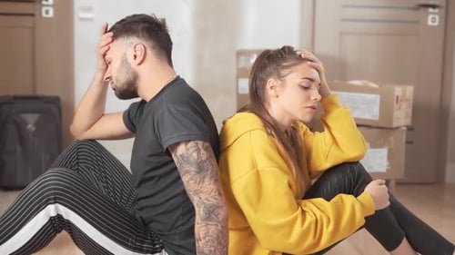 upset young family before moving