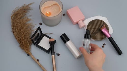 Cosmetics and Beauty Products with Lit Candle