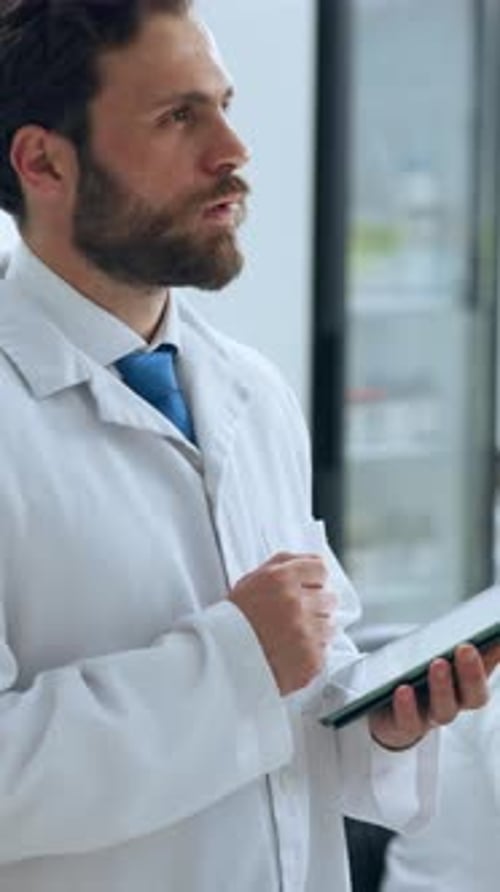 Scientist Using Tablet in Modern Laboratory Setting