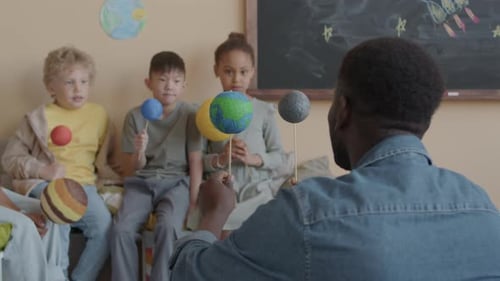 Teacher Presents Solar System to Eager Students