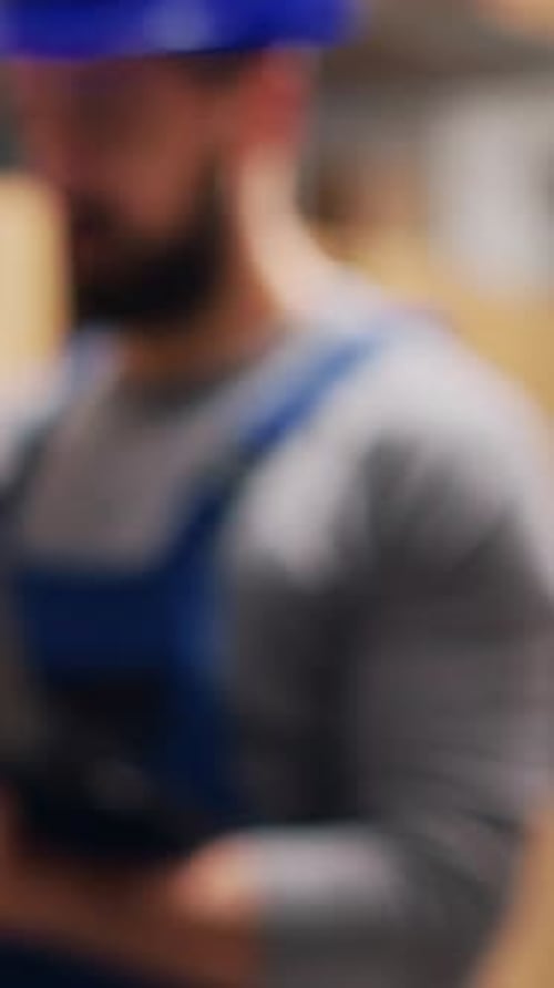 Vertical Video Depot Supervisor Holding Laptop with Stock Logistics List