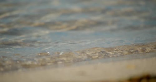 Close Up, Peaceful Waves Crashing Onto Beach