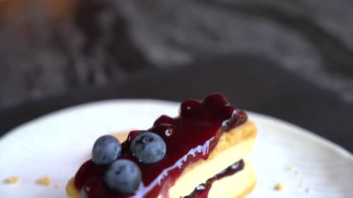 Close-up of Blueberry Cheesecake Dessert on White Plate