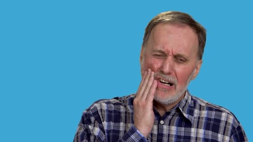 Senior Man Suffering from Severe Tooth Pain