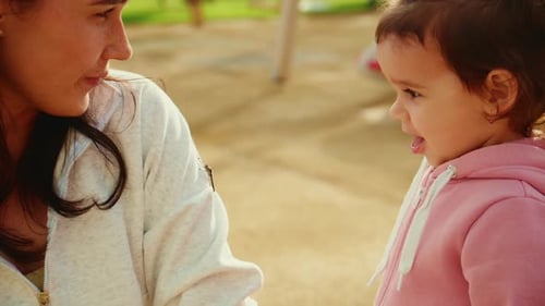 Mother and infant at the playground outdoors
