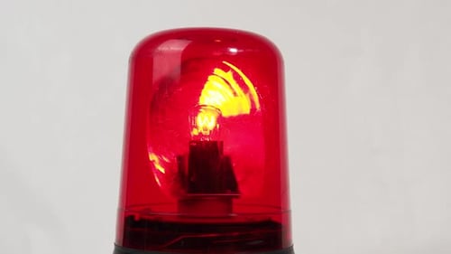Red flasher on a white background. Red signal beacon.