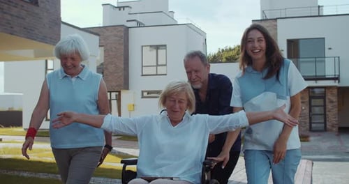 Smiling Seniors Walk Together in Suburban Setting