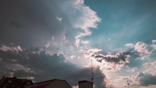 Angelic sunlight beams shine beautiful through moving clouds, colorful sundown, time lapse