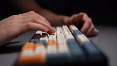 Closeup Hands of Unrecognizable Man Typing on Wireless Mechanical Gaming RGB Keyboard with Stylish