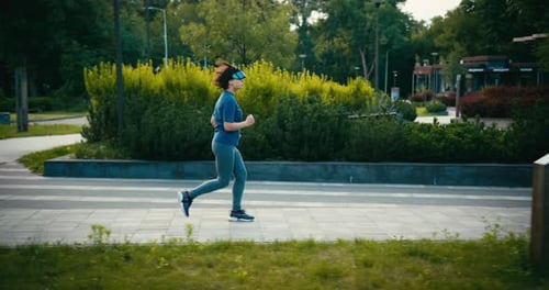 Woman Jogging with VR Goggles in Green Park