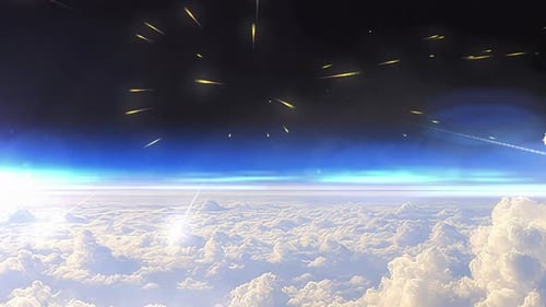 Glowing meteors falling above the clouds