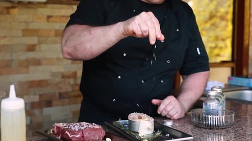 chef prepares a salmon dish in the kitchen. Close-up shots