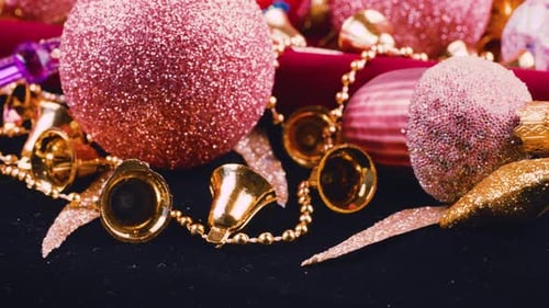 Festive Christmas decorations close-up. Sparkling baubles and golden bells.