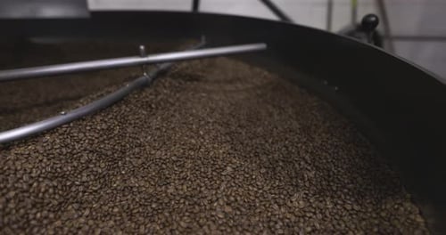 Close Up Coffee Beans Drying in Coffee Roaster in Food Production Plant 10 Seconds or Greater