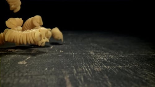 Dry Pasta Falls on the Table Filmed on a Highspeed Camera at 1000 Fps