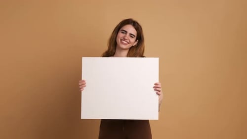 Woman Holding a Blank White Sign Smiling