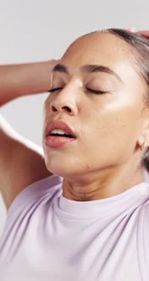 Fitness, fatigue or woman stretching in studio for workout rest, cool down or breathing for break